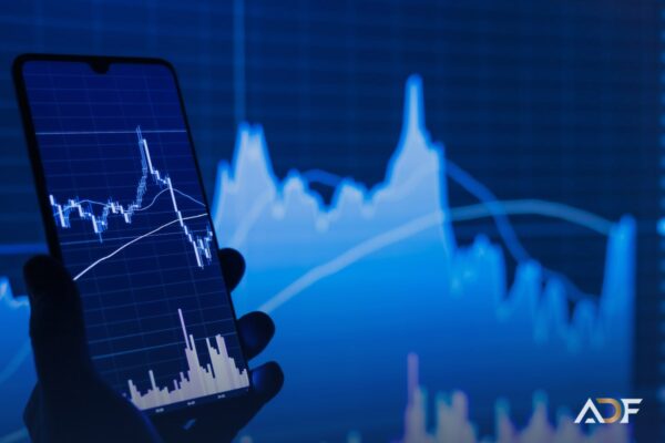 Telemóvel com gráfico de ações, guia para comprar ações na XTB